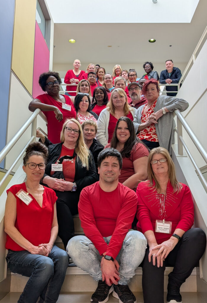 Many CUPE members for the Extendicare Central Table wearing red shirts